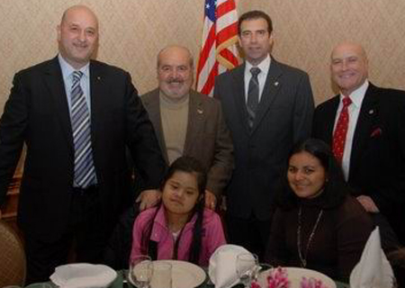 Standing (left to right) are Gift of Life Italy New York President Francesco Di Marco, Vice President Michael Iacobucci, Secretary Carl Campagna and Verrazano Rotary Club President Vincent Nativo Sr. Seated are Brenda Rivas and her mother, Yemmy Rivas.