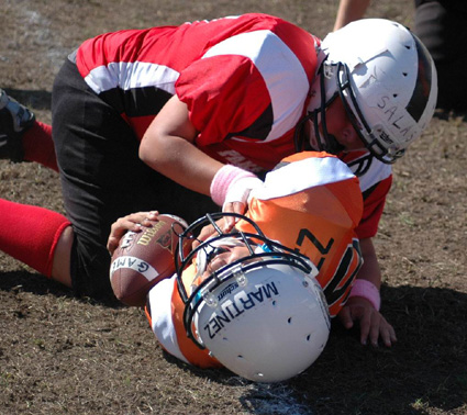 Anthony Martinez is tackled by Dylan Salas.