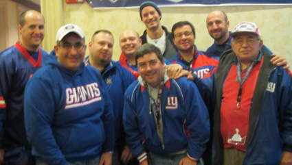 Members of Rob Olivaâ€™s traveling party pose just before Super Bowl XLVI.
