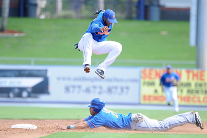 Even though itâ€™s an intrasquad game early in spring training, Met prospect and former 2008 Cyclone Wilmer Flores hustles to tag up on a slide into second base as non-roster invitee Omar Quintanilla is forced to leap aside. 		 		Photo by George Napolitano
