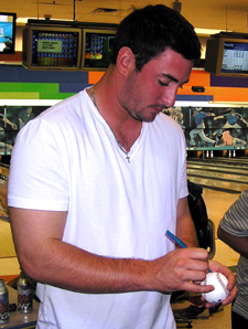 Minor league RHP Matt Harvey, the Metsâ€™ 2010 first-round draft pick, has impressed fans with his confidence and pitching prowess. During a team-building event, Harvey signs autographs for the fans at Superplay USA Bowling Alley in Port St. Lucie, Fla.