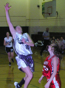Fontbonneâ€™s high scorer for the game, Cindy Henderson (13 points), leaps past her St. Johnâ€™s defender for the layup. 