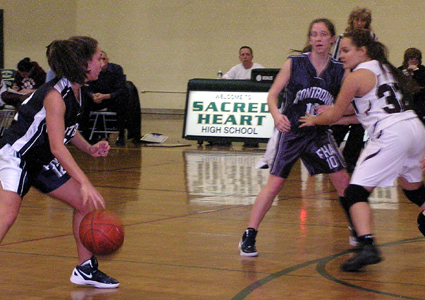 Prestonâ€™s Melissa Cwikla closely guards Cindy Henderson (#10) as Kate Oliver dribbles down, looking for an opening. 