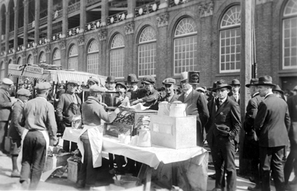 Whatâ€™s a baseball game without a hotdog? Dodgers fans are seen here buying hot dogs from a busy vendor while waiting for the gates to open for World Series Game 2 between the Dodgers (then known as the Robins) and Cleveland Indians at Ebbets Field on Oct. 6, 1920.  AP/Library of Congress