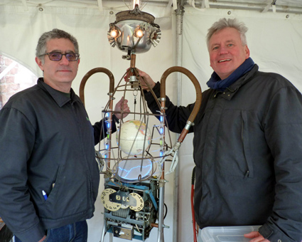 Brian Cohen of Inventgenuity Workshops stands with artist Steve Gerberich, who constructed the electromechanical  â€œToborâ€ (which is â€œRobotâ€ spelled backwards).