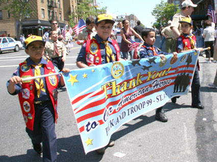 Cub Scouts from Troop 99 show their support. Photo by Ray Aalbue