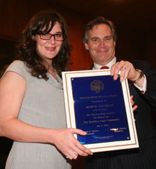 Attorney Robin Goeman accepted the Distinguished Service Award from BBA President Ethan Gerber. 
