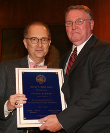 New York City Criminal Courts Administrative Judge Barry Kamins (left) presented clerk Joseph Rebasti (right) with the Hon. Nathan R. Sobel Award. 