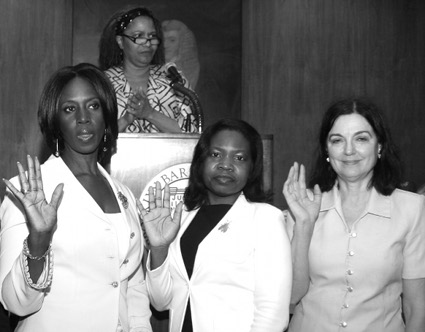 Hon. Juanita Bing Newton administers the oath of office to the BWBA officers and directors, including Hon. Sylvia Ash (left), Hon. Genine Edwards (center), and attorney Barbara Grcevic. 