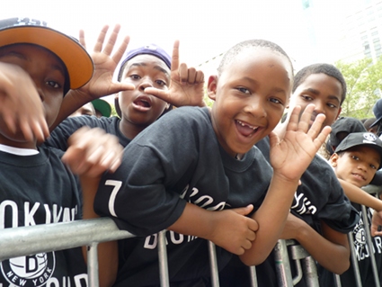 Kids show their enthusiasm for the new Nets lineup. Photo by Mary Frost