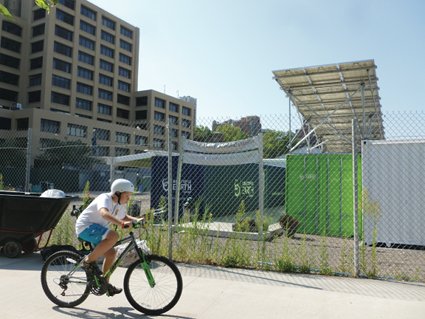 Among temporary structures in the park is a center for recharging electric vehicles, also used for lectures on sustainability by the Brooklyn Bridge Park Conservancy. Photo by Henrik Krogius