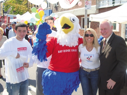 Eddie the Eagle and Lori Pedone share a cheerful moment with Senator Marty Golden on Third Avenue. Eagle file photo