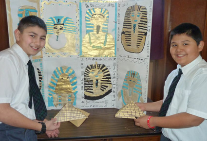 Robert Ghiz (left) and Marc Maquiling show off their paper pyramids, part of their project on the art and culture of the ancient Egyptians, which was on display for St. Patrick School’s Art Fair.