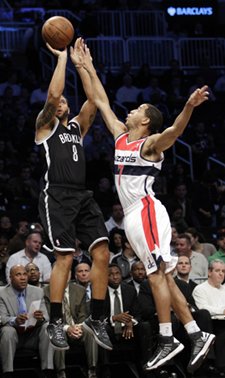 Deron Williams, Brooklyn's $100 million point guard, dished out nine assists during Monday night's Barclays debut.  AP Photo