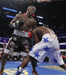 Brooklyn resident Peter "Kid Chocolate" Quillin knocked down middleweight champion Hassan D'Nam of France six times en route to capturing the belt Saturday night in the most exciting bout on the first-ever Barclays Center boxing card.  AP Photo   