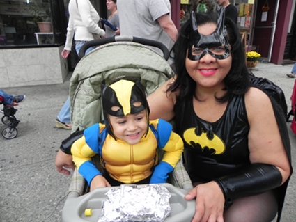 Yvette Mendoz, AKA Batgirl, and her son, Jayson, age 4, AKA Captain America, get ready to make their debut in the parade.