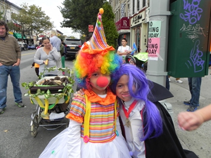 See, clowns and vampires can be friends! Skyla Echevarria, left, gets ready for the parade with Alexis Gonzalez.