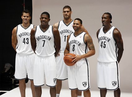 From left to right, Kris Humphries, Joe Johnson, Brook Lopez, Gerald Wallace and Deron Williams show off the Nets' home uniforms during media day at the Barclays Center on Monday.  AP Photo  