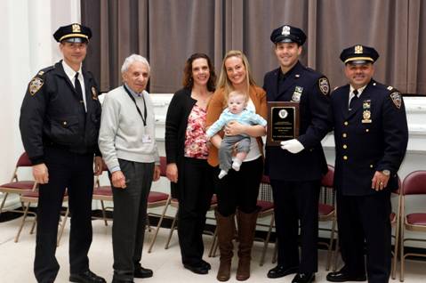 From left to right: 84th Precinct Executive Officer Capt. Anthony Lemmiti, Community Council President Leslie Lewis, Cop of the Month Joseph Swicicki’s Mother, Swicicki’s wife and son, Cop of the Month Joseph Swicicki and Capt. Maximo Tolentino. Photo: of Leslie Lewis
