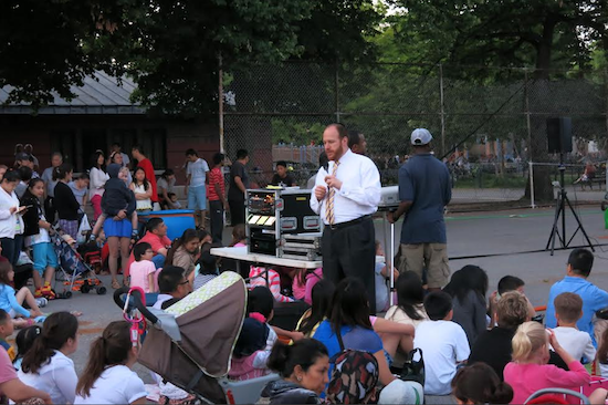 Councilman David Greenfield welcomes residents to a free movie screening in a park last year