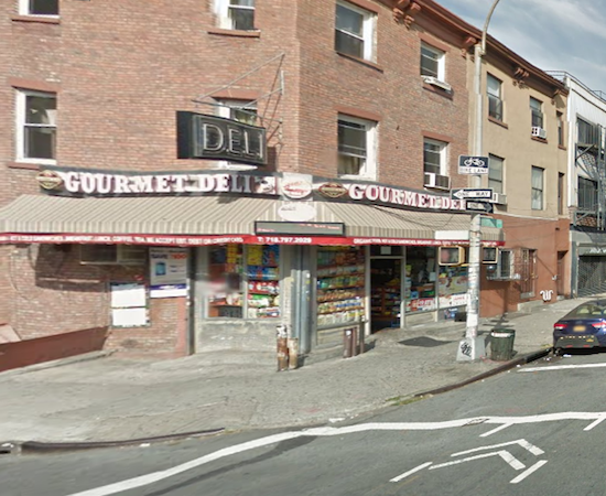 A garbage truck crashed into this Brooklyn deli early Friday morning