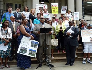 Rev. Dr. Johnnie Green, President of MPAC, center, joined other minority leaders on Friday to call for a halt to the sale of LICH to Fortis. Photo by Mary Frost