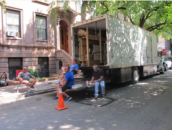 A film crew on break at Montague Terrace on Monday