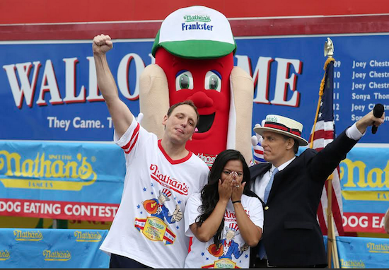 Joey Chestnut proposed to his girlfriend Neslie Ricasa, who said yes, before he won the Nathan’s Fourth of July Hot Dog Eating Contest by scarfing down 61 hot dogs last Friday