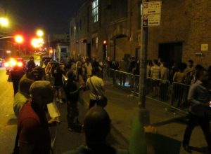 PROTESTORS AND THE LINE FOR ENTRY TO THE LYFT PARTY (PHOTO BY MATTHEW TAUB)
