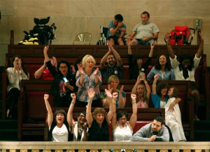People in the gallery celebrate after the Senate voted to legalize medical marijuana at the Capitol on June 20 in Albany