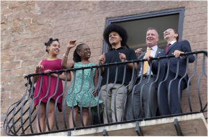 Bill de Blasio, second from right, shares a laugh with Rome Mayor Ignazio Marino, right, as he is accompanied by his family, from left; daughter Chiara, wife Chirlane McCray, and son Dante, as the look out from a balcony of Rome's Campidoglio, Capitol Hill, overlooking the Roman Forum and Colosseum