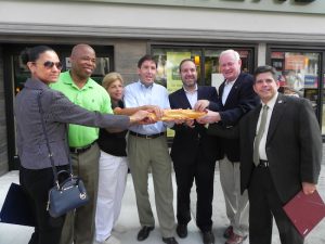 The grand opening of Brooklyn’s third Panera Bread was marked with, of course, the breaking of bread! Patricia Salas, an aide to Assemblywoman Nicole Malliotakis, Borough President Eric Adams, Linda Lupia, an aide to Assemblyman Alec Brook-Krasny, Greg George, VP of Doherty Enterprises, Carlo Scissura, president and CEO of the Brooklyn Chamber of Commerce, state Sen. Marty Golden and Councilman Vincent Gentile (left to right) get set to break the loaf of Italian bread