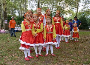 Chinese-American Planning Council’s (CPC) Beacon Dance Group watch as a dragon danced through Cadman Plaza Park at Sunday’s Walk-a-Thon fundraiser. Photo by Mary Frost