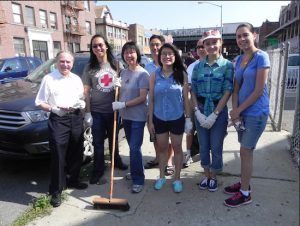 Assemblymember Bill Colton (left) gets help from a group of volunteers, including incoming Democratic District Leader Nancy Tong (third from left) in the “Speak-Up & Clean-Up” campaign to rid Bensonhurst of street litter. Throughout the morning, dozens of people came to lend a hand to the effort. At right is Priscilla Consolo, who co-founded the campaign with Colton in 2011