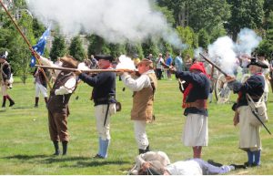 In a re-enactment of the Battle of Brooklyn, Continental Army soldiers fire away- but some had already fallen. Photos by Matthew Taub