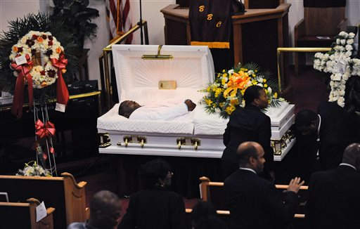 Eric Garner's body lies in a casket during his funeral at Bethel Baptist Church in Brooklyn on July 23. The man who shot the choke video is in NYPD custody on gun charges