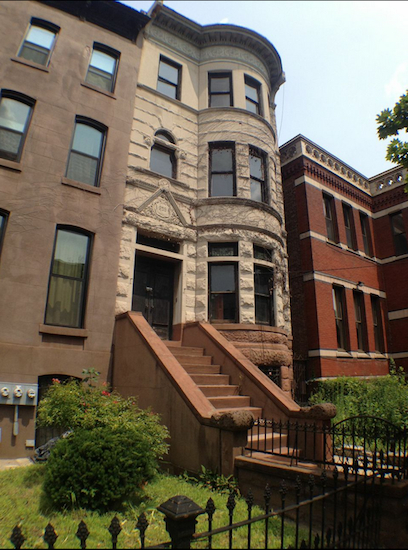 Ivory tower: This limestone row house at 259 Decatur St. is a recent Aussie acquisition. Part of St. Philips Episcopal Church is visible at right