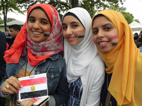 Nehad Mohamed (left), Dina Abdelrahman (center), and Ruah Zeid got their faces painted with flags from Middle Eastern countries in a show of pride.