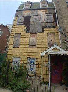 The new owners of burnt-up 11 Van Buren St. in Bed-Stuy have not decided whether to demolish or renovate it. Eagle photo by Lore Croghan