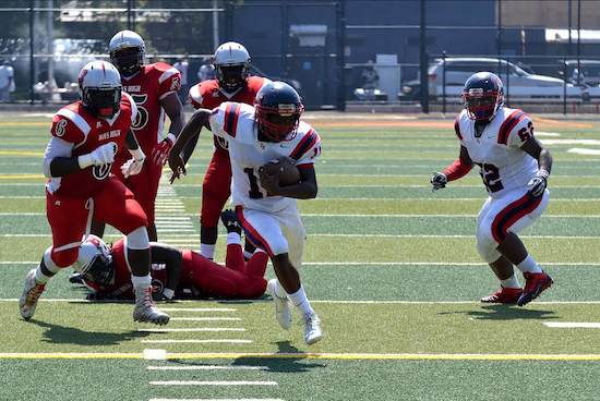 Quarterback Aaron Grant (11) showed off exceptional speed as he ran for more than 100 yards and three touchdowns, leading Erasmus Hall to beat Boys and Girls High School 36-8 during the first game of the season.