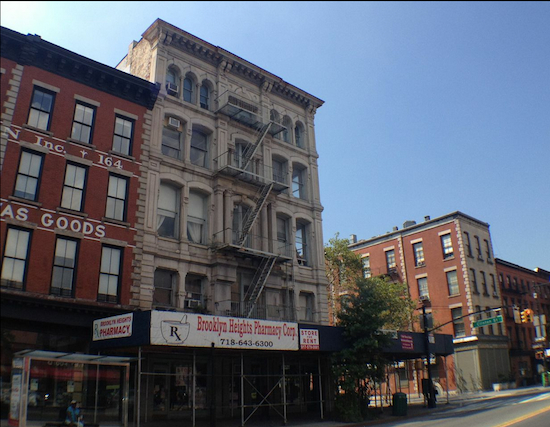 That's 160 Atlantic Avenue, with the sidewalk shed — which kept would-be customers from finding Brooklyn Heights Pharmacy, the owner of the now-departed drugstore told us.