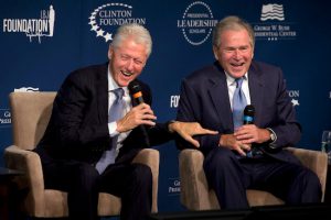 Former Presidents Bill Clinton, left, and George W. Bush, laugh while participating in the Presidential Leadership Scholars Program Launch on Monday at The Newseum in Washington.