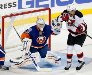 Chad Johnson stood tall in net Friday night as the Islanders posted their first-ever win in Brooklyn, 3-2, over the visiting New Jersey Devils at Barclays Center.