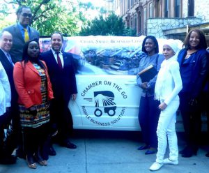 Councilmember Robert E. Cornegy (second from left) and Brooklyn Chamber of Commerce President and CEO Carlo Scissura (left, center) joined in unveiling “Chamber on the Go” on Thursday. Photo by Michael Pantelidis