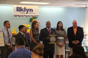 Borough President Eric Adams announces his $6.92 million capital budget investment in libraries and cultural institutions at a press conference at Bay Ridge Library