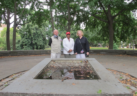 Jose Nieto, Wilhemena Rhodes Kelly and Ruth Goldstein stand behind the desecrated plaque sute in Fort Greene Park.