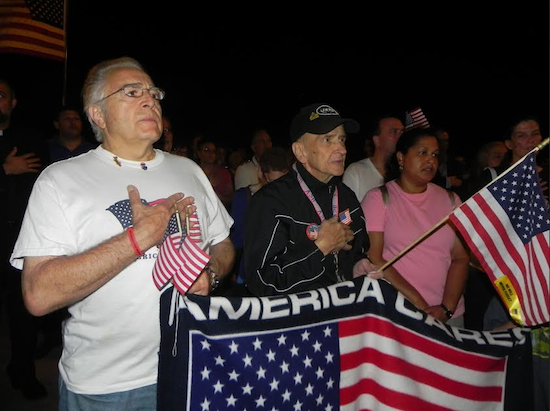 Participants salute the flag at the Sept. 11 ceremony at the 69th Street pier in Bay Ridge last year.