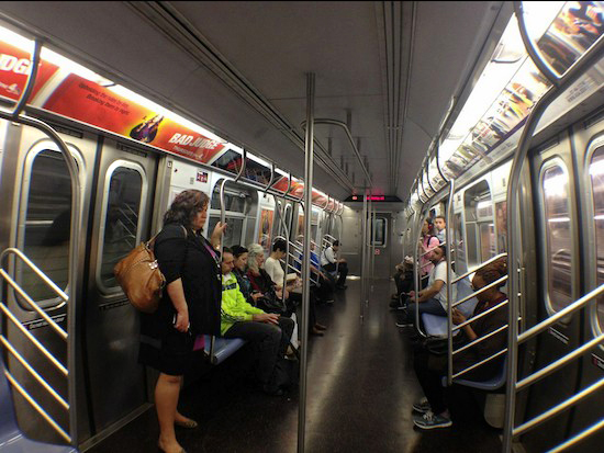 Passengers on the R train in Brooklyn. Photo by Lore Croghan