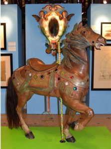This Sept. 8 photo provided by the Green-Wood Historic Fund shows a wooden horse from an amusment park carousel built by William Mangels in an exhibit of his creations at the the Green-Wood Cemetery, where he is buried.
