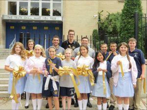 Students from Xaverian High School and Genesis, a program housed at Xaverian, show their support for the “Go Gold Bay Ridge” campaign.